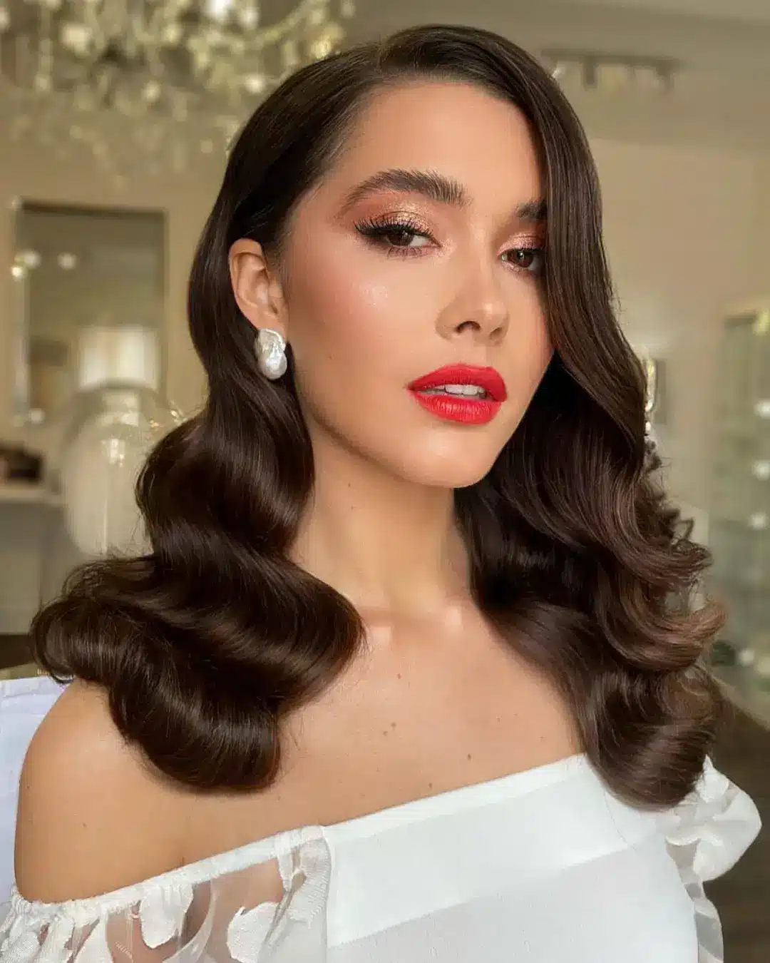 a bride with red lips and wavy hairdo