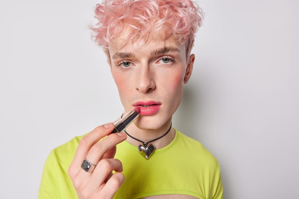 A view of a guy wearing makeup